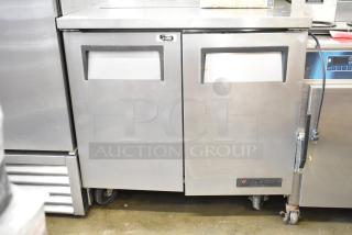 True TSSU-36-08 undercounter cooler, silver, two-door, on commercial casters, 115V, 1 phase, used condition.