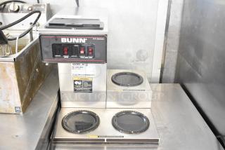 Bunn VP17-3 commercial coffee machine with three burners, stainless steel, 120 volts, used condition, model label visible.