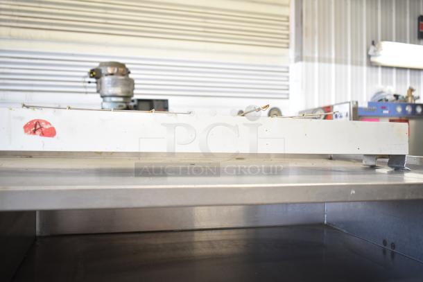 Hatco Ultra Glo Commercial Heat Strip, showing a white metal casing with a visible red label marked "A," placed on a metal counter.