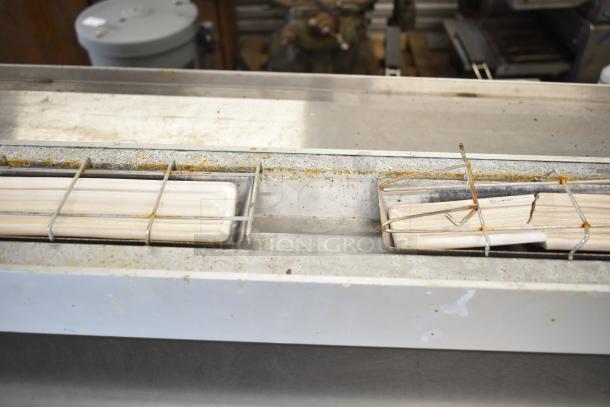 Hatco Ultra Glo Commercial Heat Strip, shows wear and rust, metal frame with heating elements, ideal for commercial use.