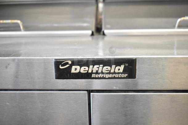 Delfield sandwich salad prep table with Bain Marie mega top, 4 drawers, and over shelf. Features 115V, 1 phase power.