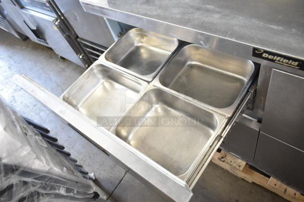 Delfield commercial prep table with mega top, 4 stainless steel drawers, and over-shelf. 115 volts, 1 phase. Slight wear.