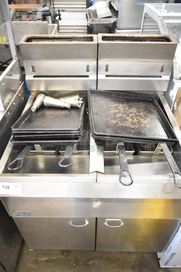 Pitco Frialator commercial gas deep fat fryer with dual baskets, stainless steel body, includes trays and funnels, used condition.