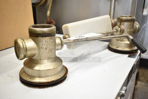 2 industrial sink drains, metal, with levers, used condition, visible marking "For More Info" and auction tag "140".