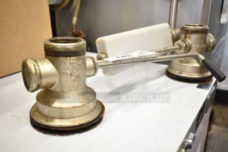 2 industrial sink drains, metal, with levers, used condition, visible marking "For More Info" and auction tag "140".