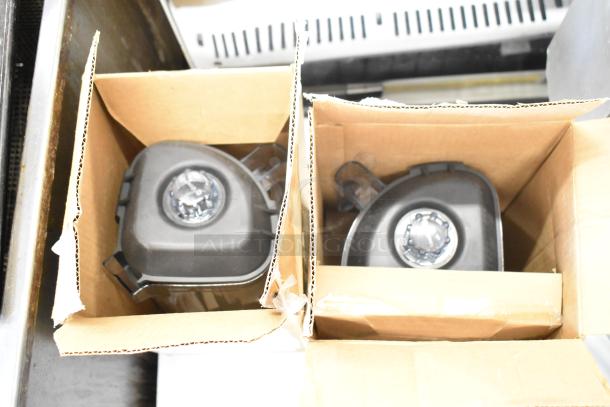 Two brand new Vitamix blender pitchers in cardboard boxes; marked as scratch and dent.