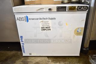 American BioTech Supply chest freezer, white, labeled for vaccines, “DO NOT UNPLUG.” Visible wear, includes digital controls.