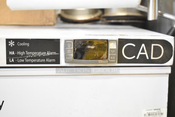 American BioTech Supply chest freezer with Dixell control panel. Features high/low temperature alarms. Visible wear on display.