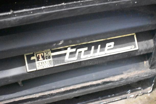 True GDM-10 commercial single door cooler merchandiser with brand logo. 115 volts, 1 phase.