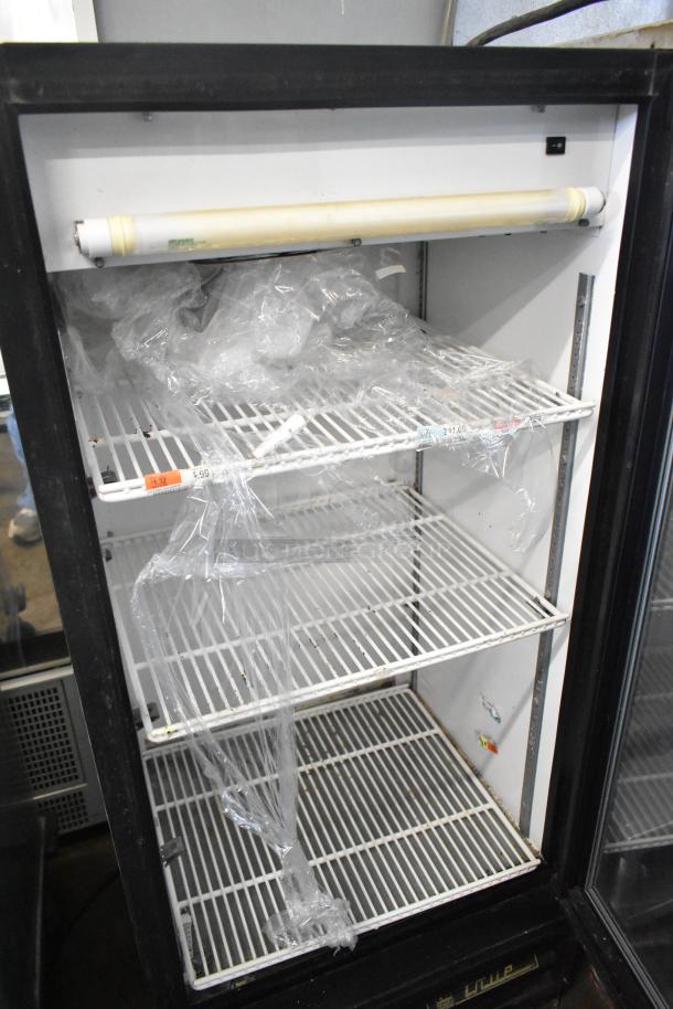 True GDM-10 commercial single door cooler, three shelves, visible wear, 115 volts, 1 phase, for merchandising.