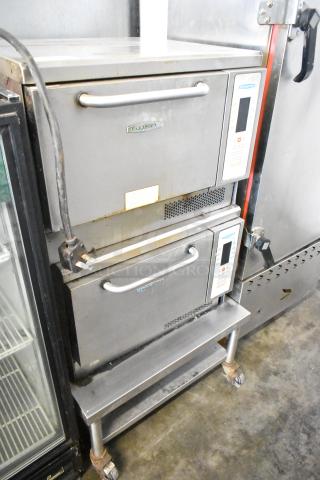 Two Turbochef NGC rapid cook ovens on a metal stand. Electric, 208/240V, 1 phase. Commercial use, visible control panels.