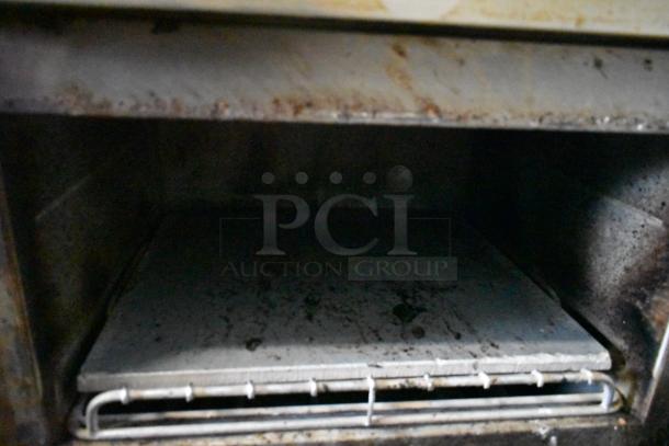 Two Turbochef NGC rapid cook ovens on a stand. Used condition, electric-powered, 208/240V, 1 phase. Interior view shown.