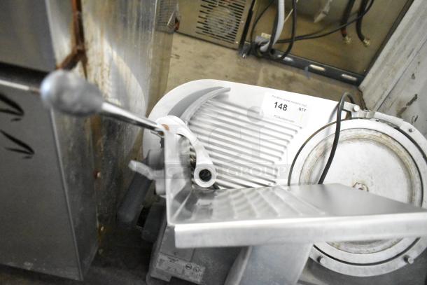 Hobart commercial countertop meat slicer, 115 volts, 1-phase, visible slicer blade, good condition, label with auction number 148.