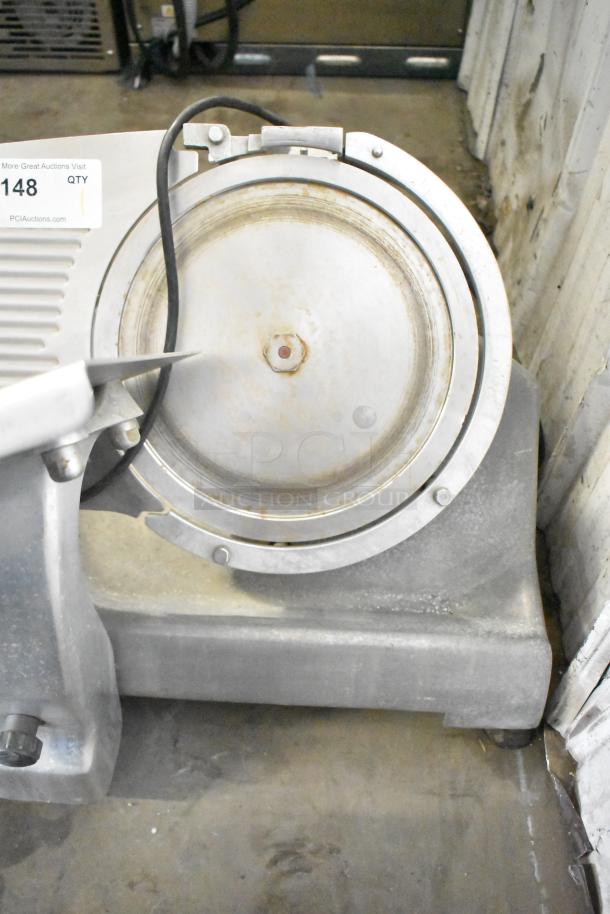 Hobart Commercial Countertop Meat Slicer, 115 Volts, 1 Phase. Industrial-grade, visible wear, includes slicer blade.