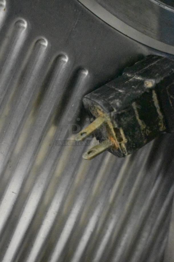 Hobart commercial countertop meat slicer, 115 volts, 1 phase, showing plug and ridged metal surface.