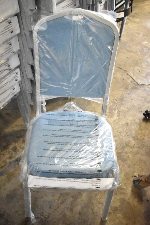 Brand new Flash Furniture HERCULES Series banquet chair, blue fabric, silver frame, wrapped in protective film.