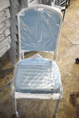 Brand new Flash Furniture HERCULES Series banquet chair, blue fabric, silver frame, wrapped in protective film.