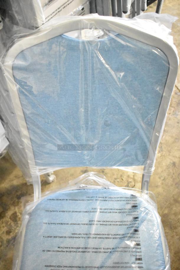120 brand new Flash Furniture HERCULES Series banquet chairs, blue fabric, silver frame, in original packaging, minor scratches.