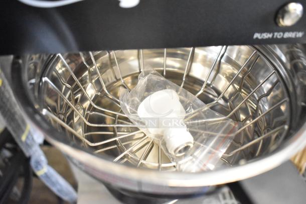 Brand new Avantco 177CMA1B automatic coffee maker with lower decanter warmer. Visible scratch and dent. Includes parts in bag.