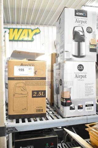 5 new Avantco and Acopa stainless steel airpots, 2.2-3.5L, with levers, boxed in warehouse. Labels indicate sizes and models.