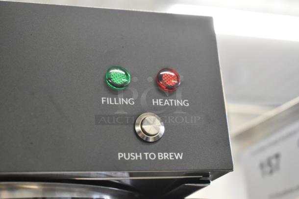 Brand new Avantco CMA1L2U coffee maker with 3 warmers. Features filling, heating indicators, and push to brew button.