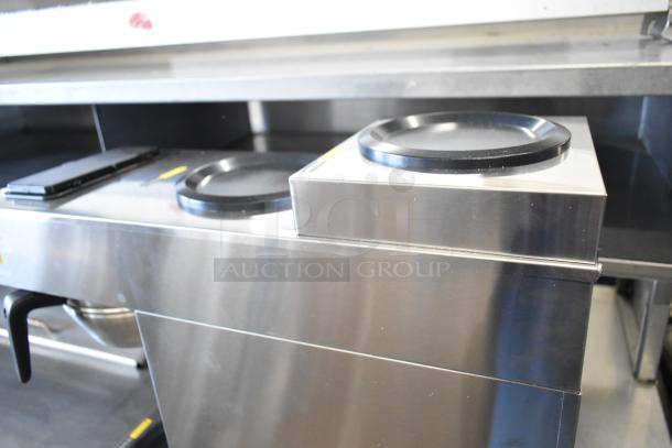 Brand new Avantco CMA1L2U automatic coffee maker with 3 decanter warmers, 120V, stainless steel, slight scratches.