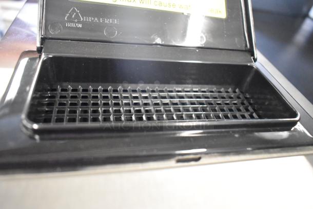 Brand new Avantco CMA2B coffee maker with 2 warmers. Scratch and dent condition. Tritan BPA-free marking visible.