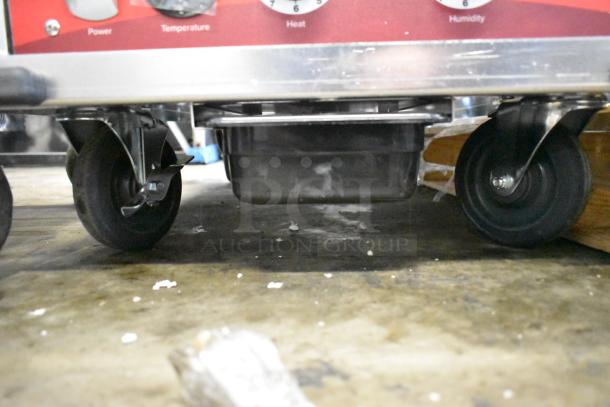 Avantco 177HPI1836 insulated heated cabinet on caster wheels, new with minor scratches. Features dials for power, temperature, and humidity control.