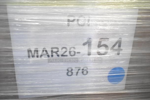 Pallet wrapped with plastic, showing label reading "MAR26-154, 876" for auction items including bar stool and cart.