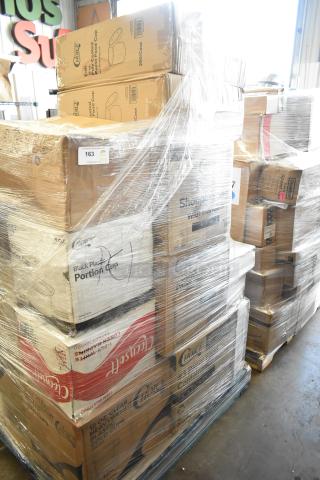 Pallet of 28 new scratch and dent items, including Choice brand cold cups, hot cups, gloves, and food trays.