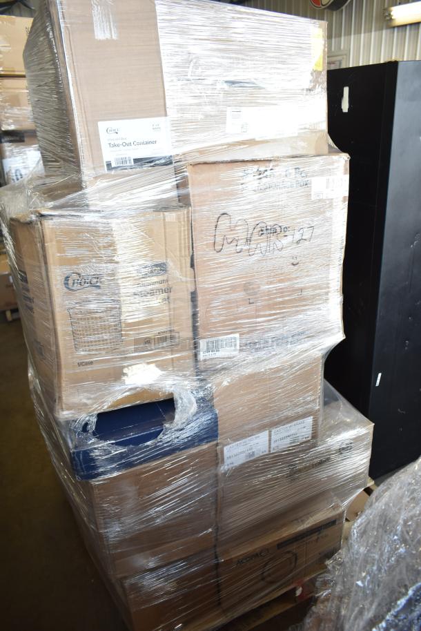 Pallet of brand new scratch-and-dent items wrapped in plastic, including boxed glasses, faucet, vases, knives, pasta bowls.