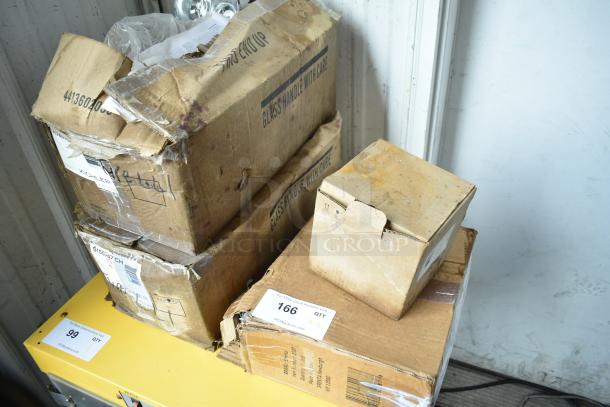 Four boxes of brand new scratch and dent items, including Kichler S155747 CH, Srenta 2087. Marked "Glass Handle With Care."