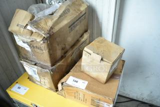 Four boxes of brand new scratch and dent items, including Kichler S155747 CH, Srenta 2087. Marked "Glass Handle With Care."