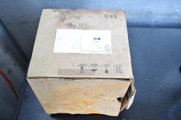 Cardboard box containing 4 new "scratch and dent" items, including Kichler S155747 CH, Srenta 2087, HNC324-XD/2.8.