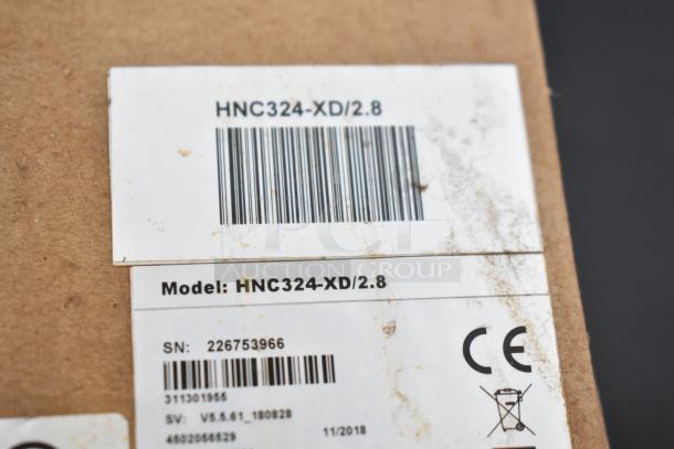 Box showing label for model HNC324-XD/2.8 with barcodes. Item is brand new with scratches and dents.