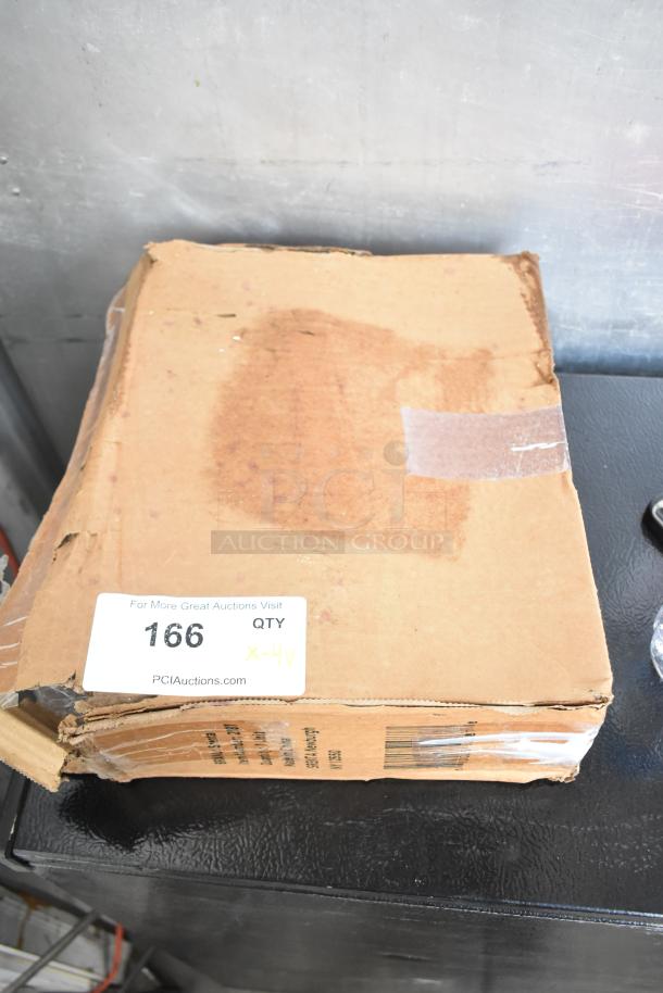 Box labeled for auction, containing 4 brand new scratch and dent items: Kichler S155747 CH, Srenta 2087, HNC324-XD/2.8.