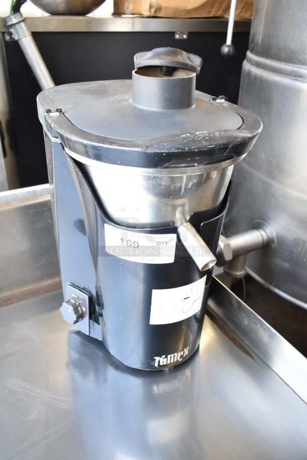 Zumex Multifruit Juicer, 120V, 1 Phase, countertop model, black and stainless steel, visible wear, product label present.