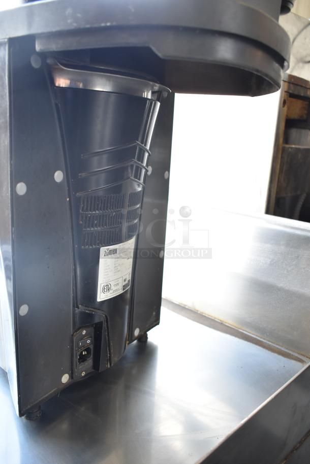 Zumex Multifruit Countertop Juicer, black model, 120V, 1 Phase. Features visible labeling and controls, clean condition.