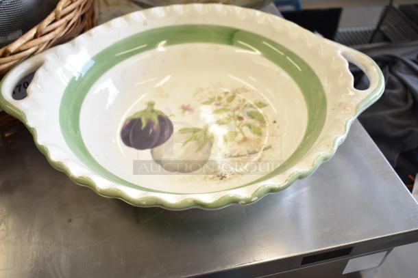 Ceramic dish with green rim and vegetable motif, used condition. Includes number tag "70" on handle. Part of 11 mixed items.