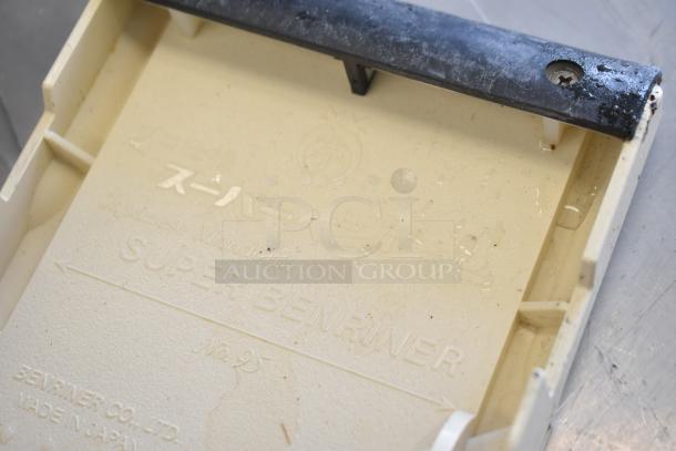 Super Benriner mandolin slicer, model No. 95. Beige body with black component. Marked "Made in Japan" by Benriner Co. Ltd.