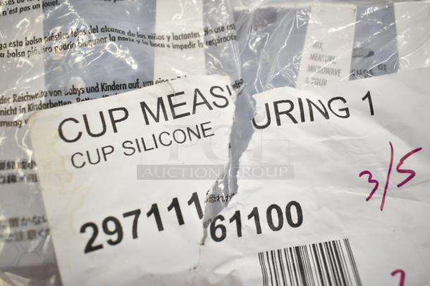 Close-up of packaging label for OXO 11161100 Good Grips silicone measuring cup, featuring product code 29711161100 and handwriting.