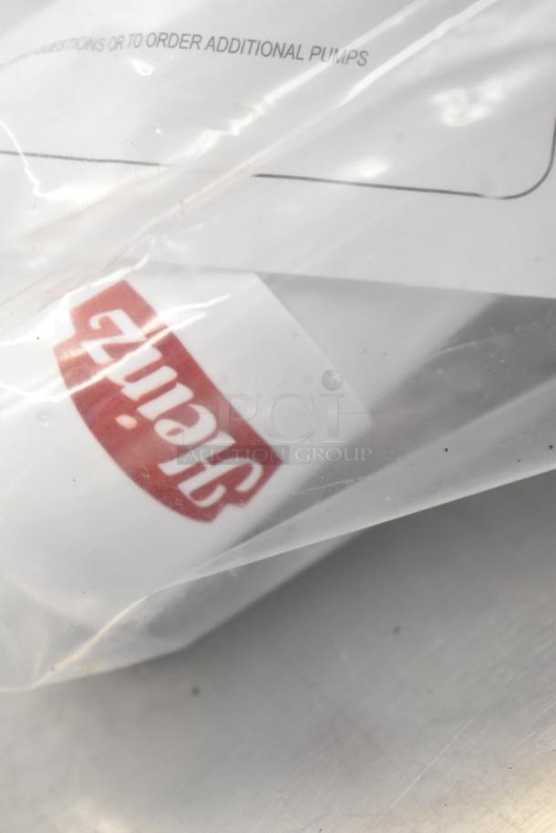 6 various items including OXO 11161100 silicone measuring cup, pump top, basting brush, and bin in packaging.