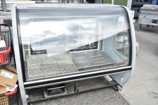 2016 Torrey TEM150+ deli display case with commercial casters, 120V, 1 phase, floor style, glass front, silver exterior.