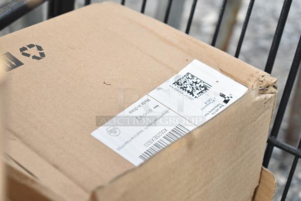 2-tier shopping cart with packages. Cardboard box labeled "Made in China." Box slightly worn with visible barcodes.
