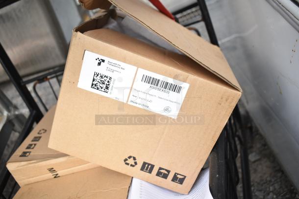 2-tier metal shopping cart filled with boxed contents, including a labeled package marked "Made in China."