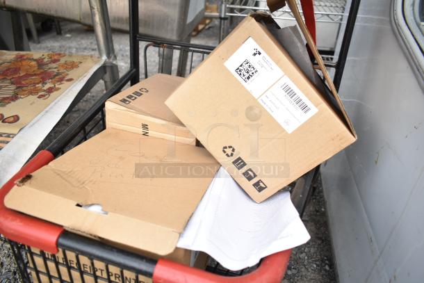 2 tier shopping cart loaded with cardboard boxes, including one labeled "Good old printer," and various contents.