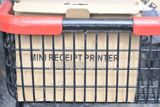 2-tier shopping cart holding a box labeled "Mini Receipt Printer," featuring black metal frame and red handles.