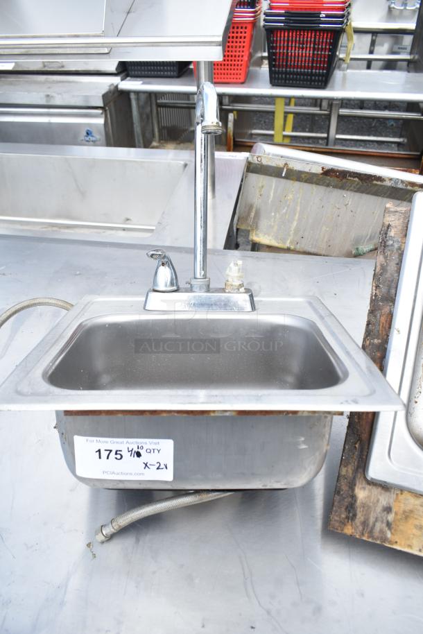 2 single bay stainless steel drop-in sinks with chrome faucets. Auction tag reads "175 1/8 QTY."