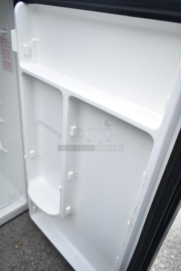 Two mini coolers: Magic Chef HMDR450BE and Insignia NS-CF33BK8. Interior view showing shelf space. 115 volts, 1 phase.