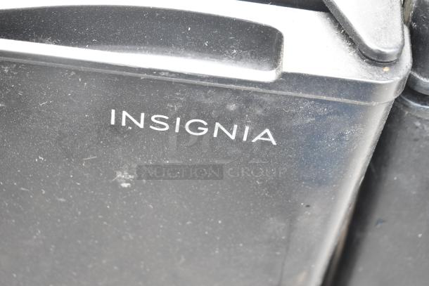 Insignia NS-CF33BK8 mini cooler, black, with visible logo, 115 volts, 1 phase, in used condition.